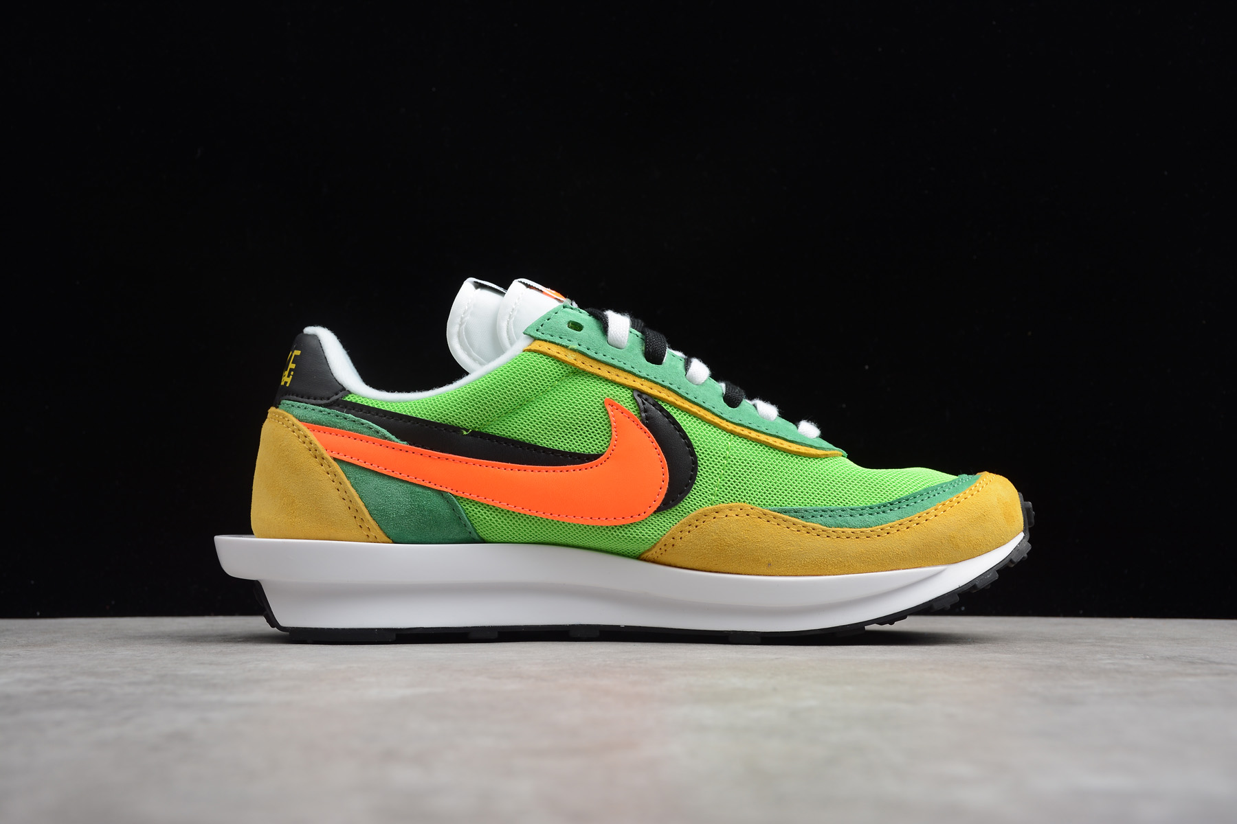 green and orange nike shoes