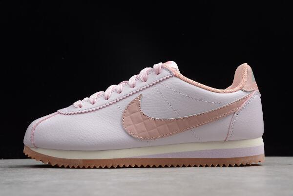 white and pink nike cortez